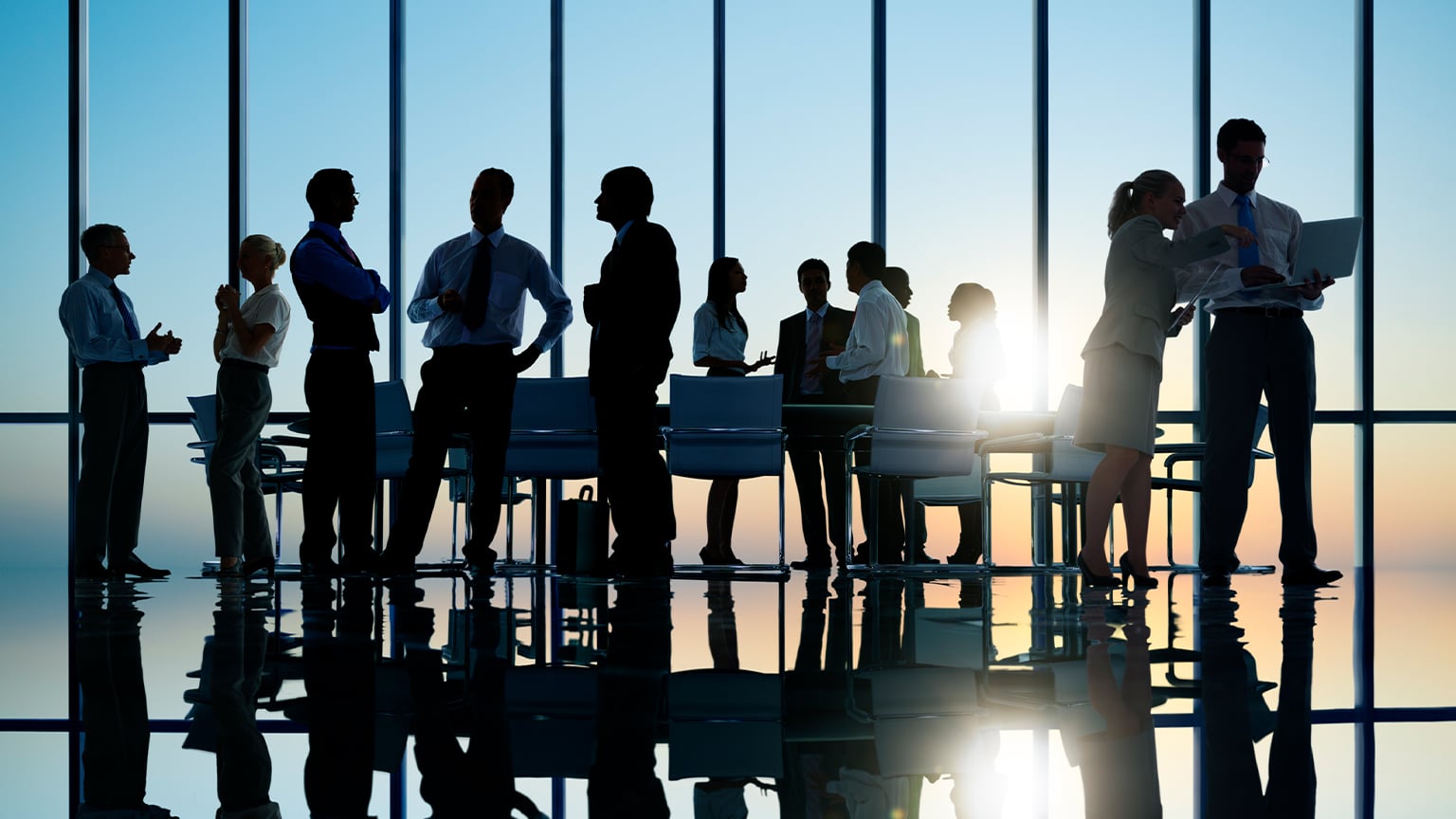 Business professionals networking and chatting at a TCR event